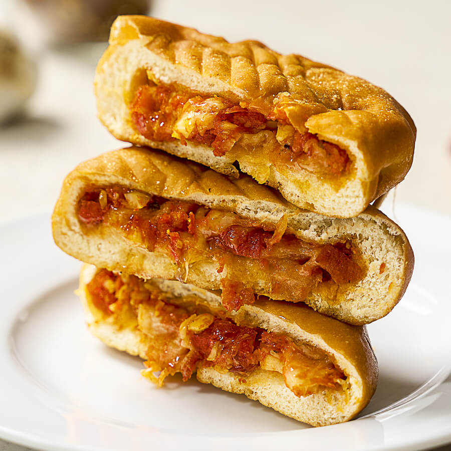 Clara's Kitchen Pepperoni Pizza Pocket stacked on one another.